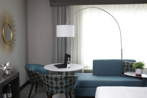 Arch lamp in sitting area of suite room