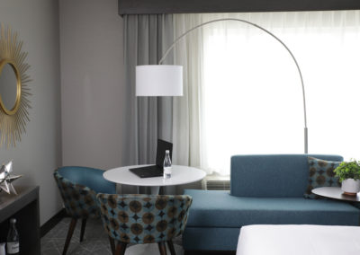 Arch lamp in sitting area of suite room